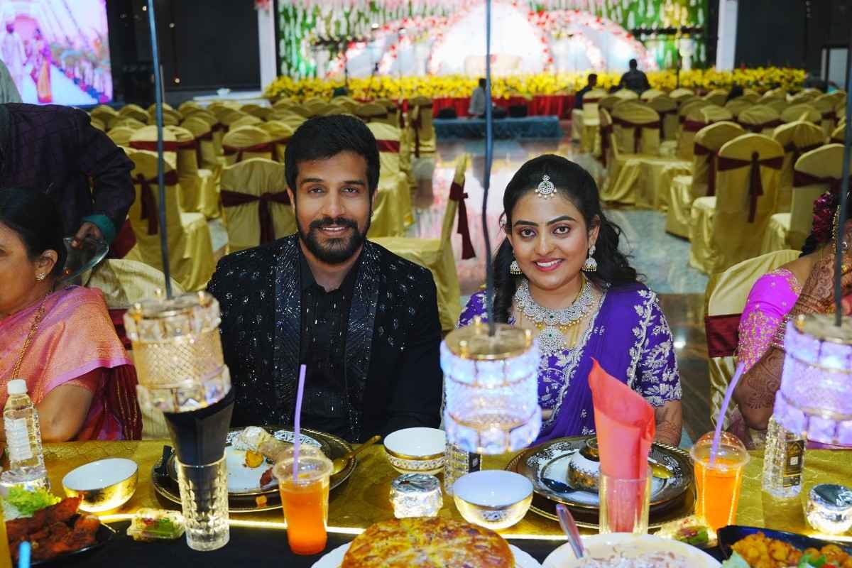 Bride and groom enjoying wedding feast by Desire Caterers