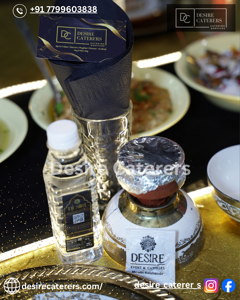 Desire Caterers elegant branded table setup with premium presentation at catering event in Hyderabad